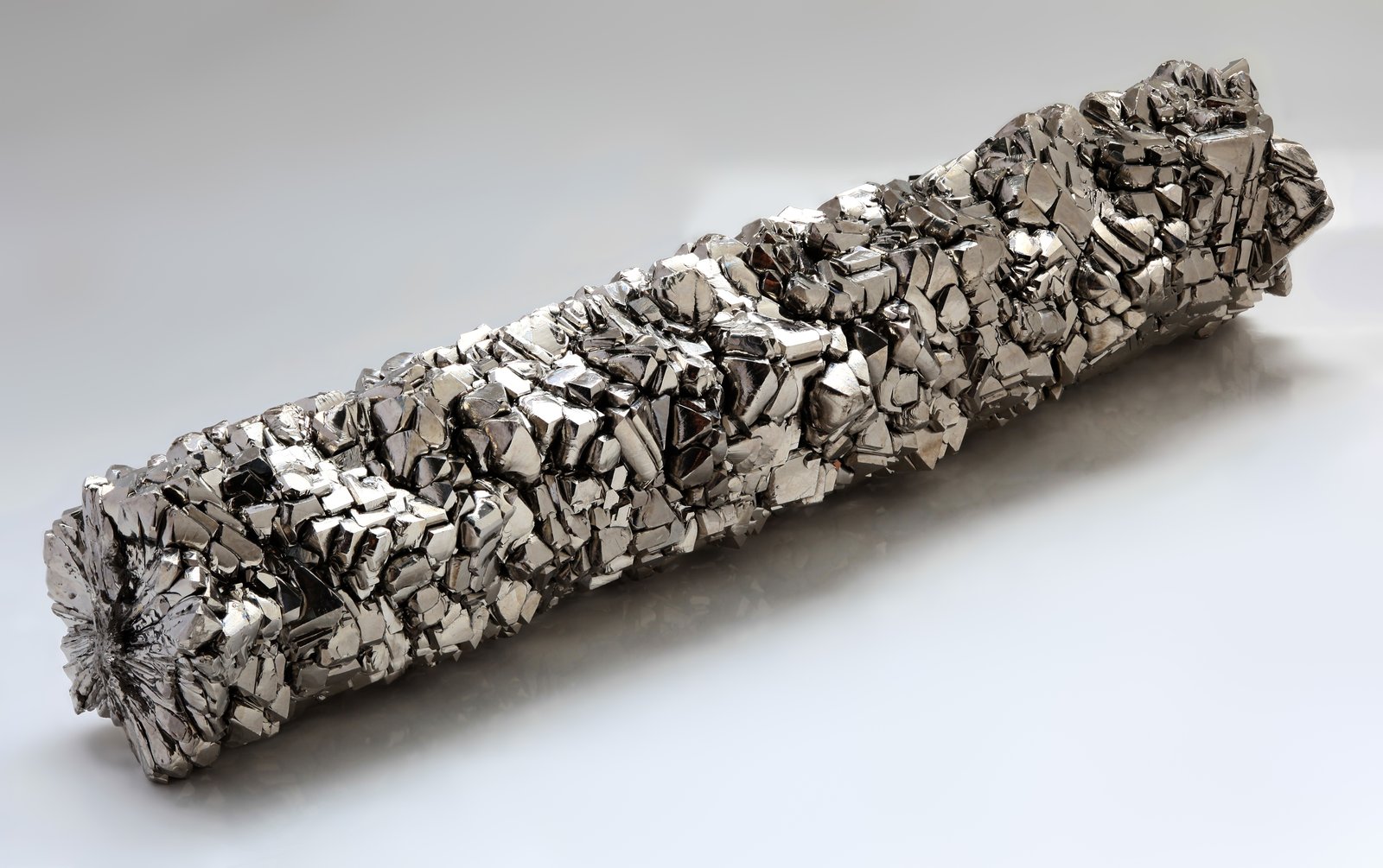 Crystalline bar of pure titanium showing the silver metallic surface
